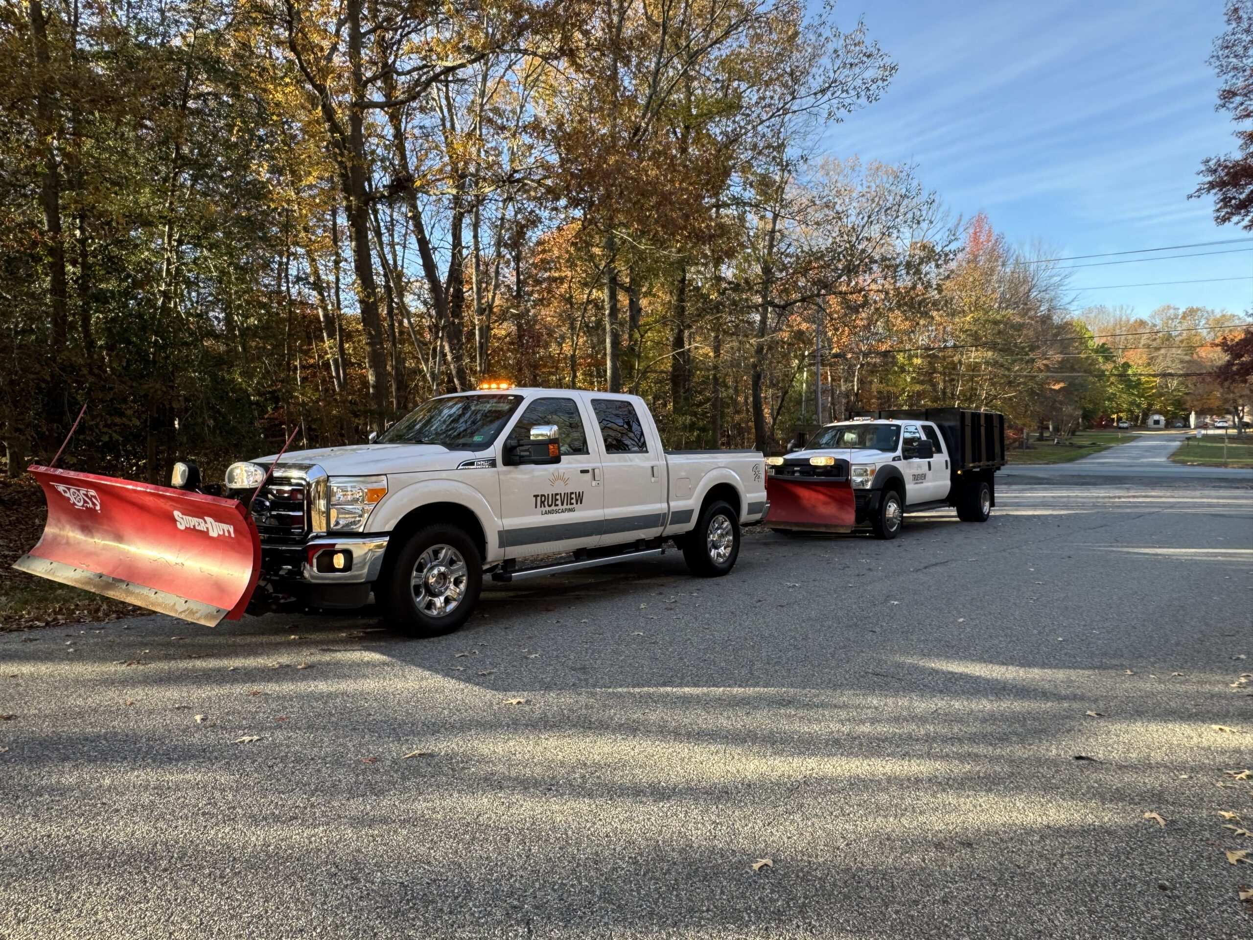 image of snow plowing truck for snow and ice management services in southern maryland